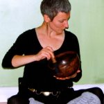 ANXIETY WORKSHOP AT YOGA WELL 03.19.11 playing the singing bowl1 CROP